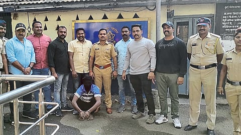 Police escorting the suspect.