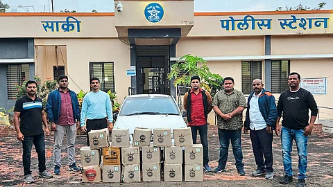 Team present with liquor seized by LCB.