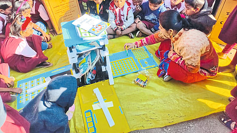 Navagaon: Teacher Sonali Dalvi is giving a pleasant learning experience to the students by using supplementary educational materials in the school here