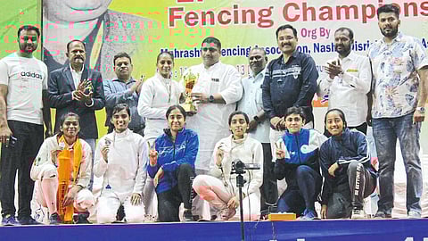 On honor of being present with the winners of the National Fencing Championships.