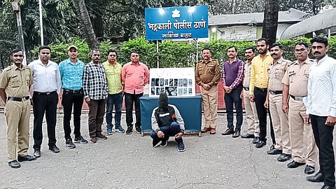 Suspect and team personnel along with the items seized from the suspect