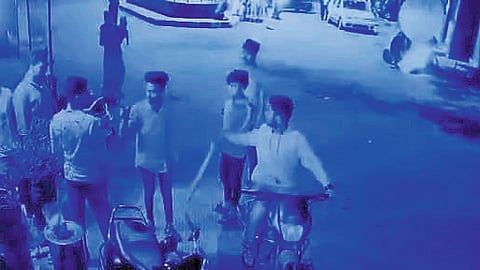 Village gang while beating youth.