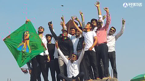 Kite lovers enjoy flying kites on the roof of a building on the occasion of Makar Sankranti on Sunday.