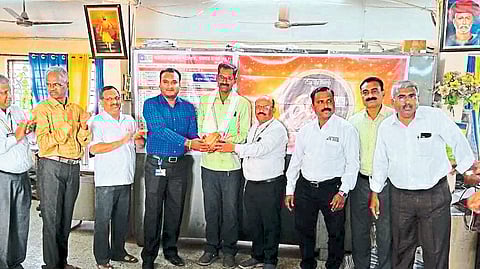 Officials felicitating Sudam Gadekar for receiving LIC's International Standard MDRT Award