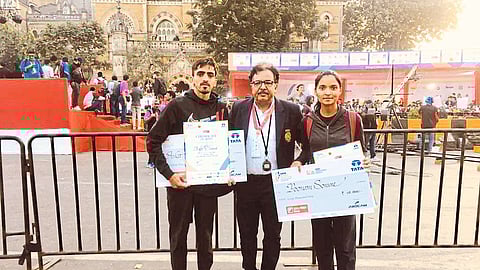 Ankit with marathon winner Poonam.