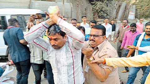 Dhule: Police detaining a citizen who attempted self-immolation in front of the Collector's office on Republic Day for the demand of City Survey copy