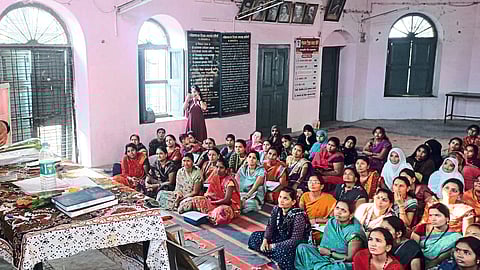Sub Divisional Police Officer Rakesh Jadhav while guiding the women