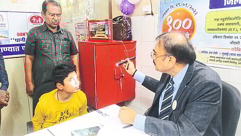 Dr. while examining the patient in the camp for acute patients in the district hospital. Nirmal Surya.