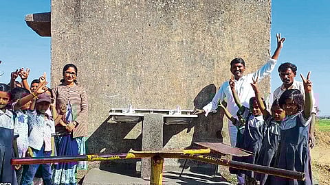Students expressing their happiness over availability of water in Zilla Parishad school.