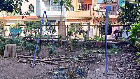 Garbage and felled trees piled up in Sri Mrityunjaya Mahadev Mandir Park.