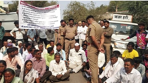 Satri villagers while blocking the road