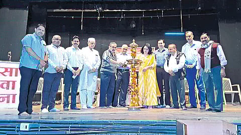 Dignitaries lighting the lamp at the inauguration of the children's drama competition