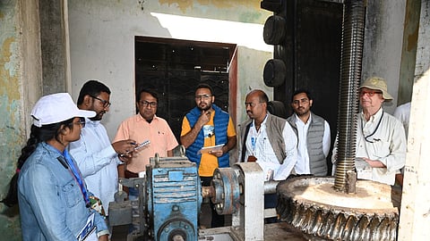 Hydrologist Daniel Renault inspecting the machinery of Palkhed Dam.