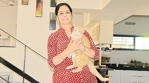 Sangeeta Rathi with her cat 'Iti' who came home after a four-day journey from the farm house.