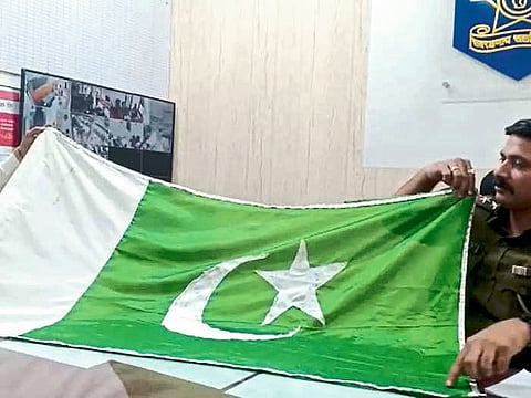 Jalgaon: Police Inspector Jaipal Hire while giving information about the seized flag