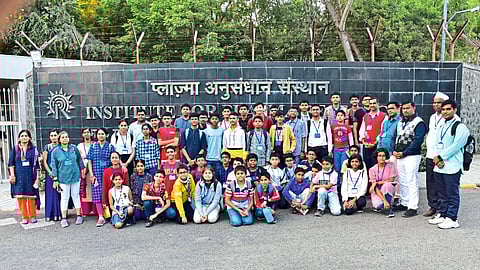 Teachers with students on a visit to an international Indian plasma research center.