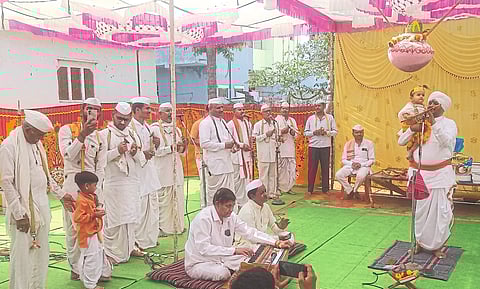 Pachora: Rishikesh Maharaj, Balashrikrishna and Talakari while breaking curds in Kaliya Kirtan during Kirtan, Dnyaneswari Parayan and Garuda Purana Week