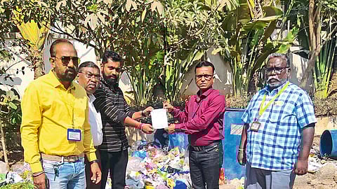 Team of Solid Waste Department while taking penal action against Karma Colony Society for non-segregation of waste