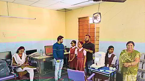 during eye examination of students through Aadhaar multi-purpose organization at Dutt Vidya Mandir School