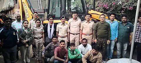 police with suspect and poclain machine