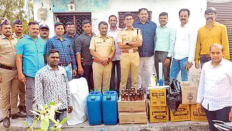 Action team with Hrishikesh Reddy present after action in fake liquor case.