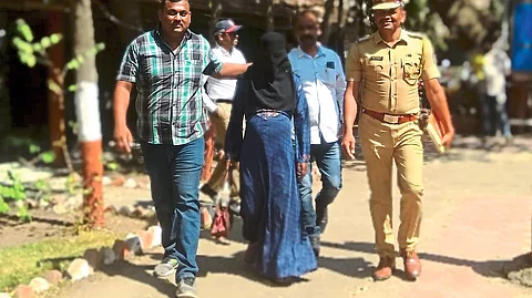 Police arresting Burkhadhari Manohar