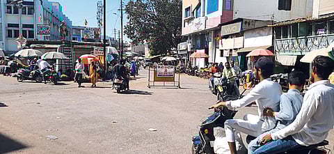 There is no traffic police near the Gandhi statue, despite the 'no entry' sign, motorcyclists are rampant
