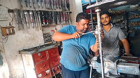 Asghar Ahmed doing repairs at Pandey Shockup shop near Jafarnagar here.