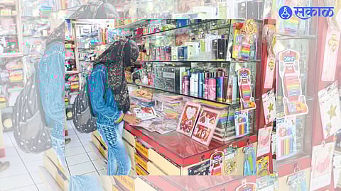 Jalgaon: A young woman looking at a greeting card in a shop