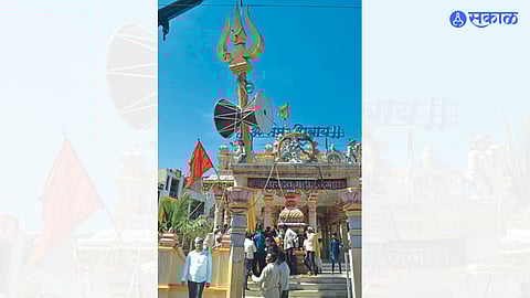 Damru with 37 feet high trishul erected in front of Mahadev temple.