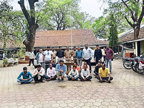 Police officers and staff with gamblers.