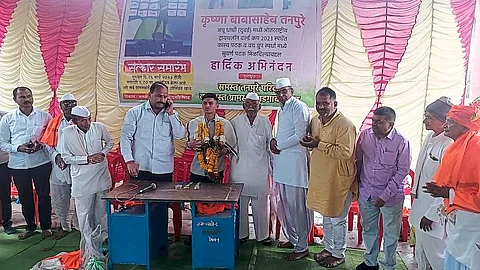 Former MLA Marotrao Pawar felicitating Krishna Tanpure, who won a gold medal in triathlon