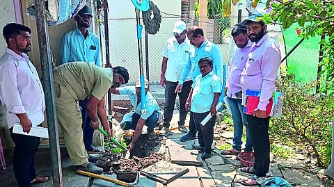 Employees disconnecting taps of tax defaulters