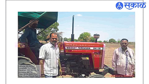Farmer Chatur Patil with a tractor purchased with the help of the mechanization scheme of the state government's agriculture department.