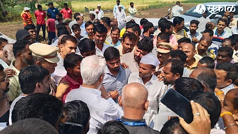 Villagers gathered around dada bhuse