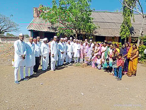 Family planting oxygen-giving trees with mother's bones.