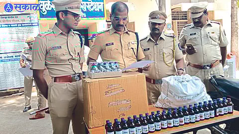 Police officers inspecting drugs.