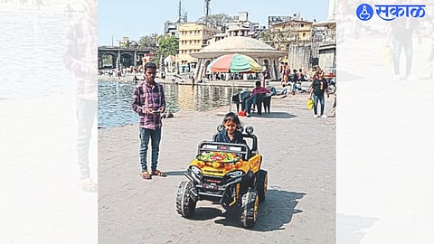 Working young people making a car trip for a small child