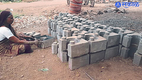 Shobhabai Kalankar making cement stoves in Kumbharwada