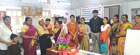 In-charge Postmaster Prashant Kapote felicitating women present on the occasion of Women's Day at the Post Office.