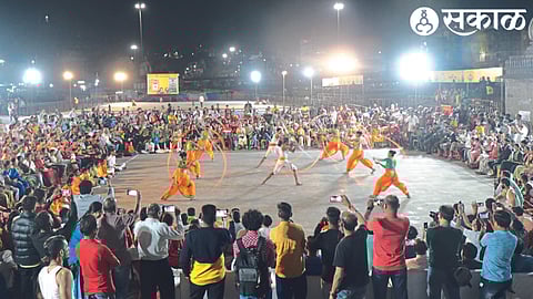 A crowd gathers at Godatira to watch the Shiva period war art demonstration organized by the Municipal Corporation and the New Year Welcome Committee