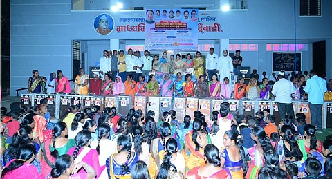 Free distribution flour mill to 25 women kiran dilip walse patil