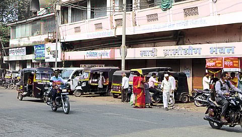Rickshaws parked in front of Khadi village industry.