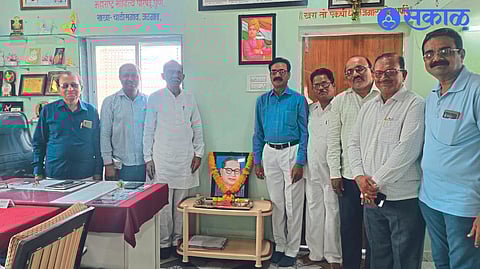 In the office of Marathi Sahitya Parishad, Dr. Council officers Tansen Jagtap, Manohar Andhale and other dignitaries while garlanding the image of Babasaheb.