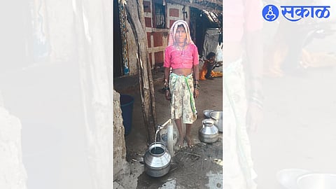 The joy on the face of a woman filling water at the tap after the water supply started as soon as the protest was given.