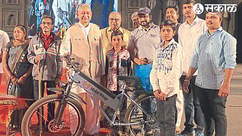 Chhatrapati Shahu Maharaj, MP Dr. while gifting an electric bicycle to Samarth. Amol Jadhav.