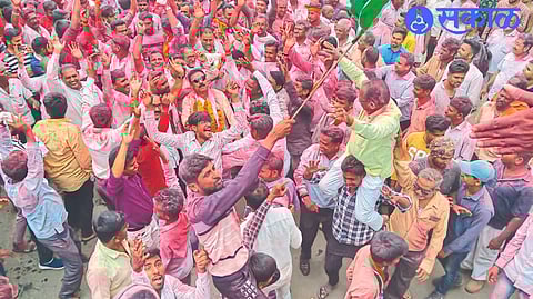 Officials and activists cheering in the procession for the election victory.