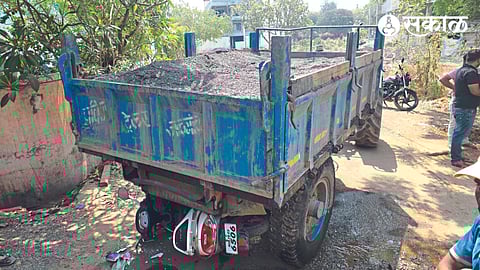 A bike crushed by a sand tractor