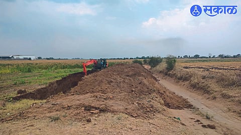 Farmers making farm road with JCB machine at own expense.