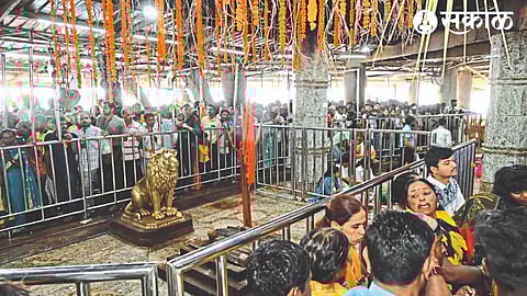On the occasion of Chaitra Purnima and Hanuman birth anniversary in the temple hall, a queue of devotees for darshan and the hall decorated with flower garlands.